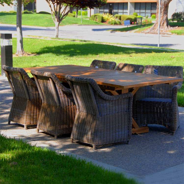 7 Pc Teak Extension Dining Table Heritage table and Monaco Wicker Chairs.